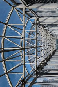 Low angle view of metallic bridge