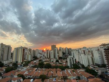 High angle view of buildings against sky during sunset
