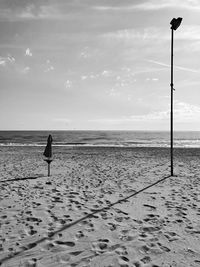 Rear view of person walking on beach