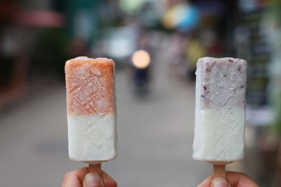 Hand holding ice cream cone