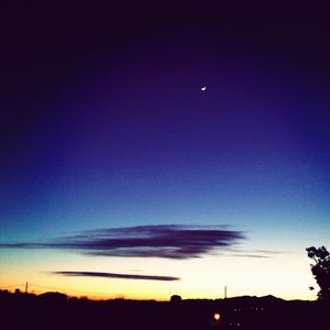 Low angle view of silhouette landscape against sky at sunset