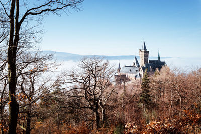 View of tower and building against sky