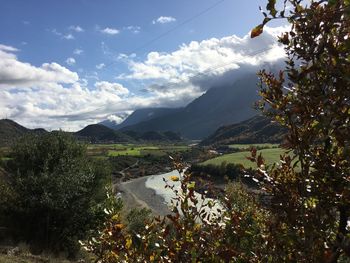 Scenic view of landscape and mountains against sky