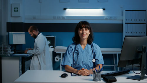 Portrait of female doctor working in office