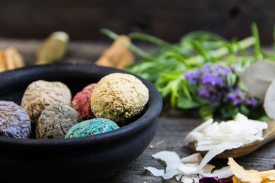 Close-up of purple flowers in bowl on table