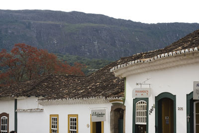 View of buildings against mountain range