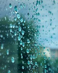 Full frame shot of wet glass window