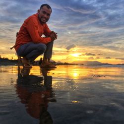 Full length of man on beach during sunset