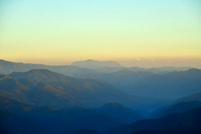 Scenic view of mountains against sky during sunset
