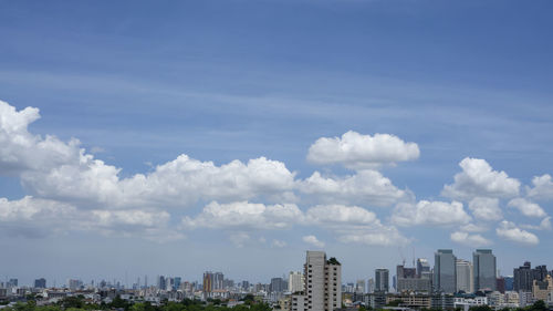 Buildings in city against sky