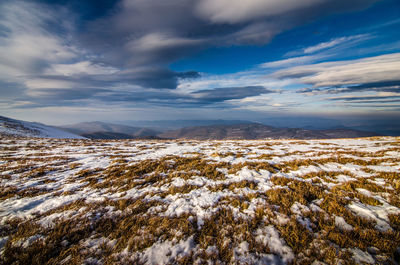 Scenic view of snowcapped mountains against sky