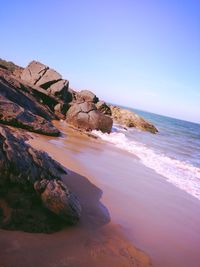 Tilt image of rock formations at beach