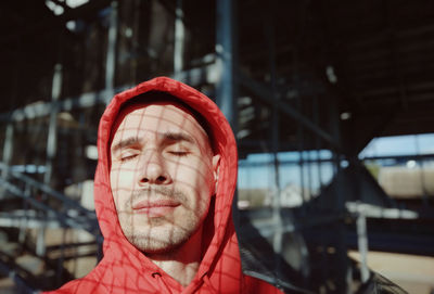 Portrait of man wearing red hat