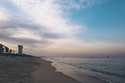 Scenic view of beach against sky during sunset