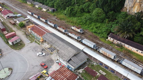 High angle view of railroad tracks by road in city