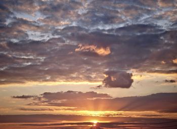 Low angle view of dramatic sky during sunset