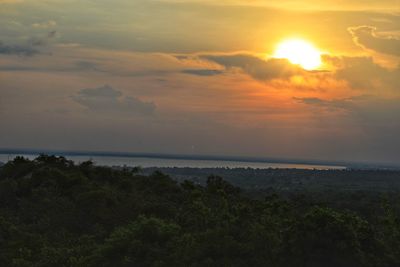 Scenic view of sea against sunset sky