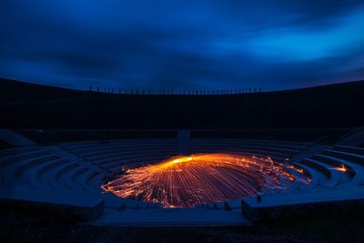 Wire wool against sky at amphitheatre during night