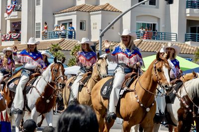 People riding at town square