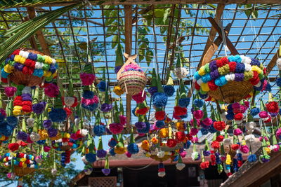 Low angle view of decoration hanging for sale in market