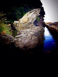 River flowing against sky