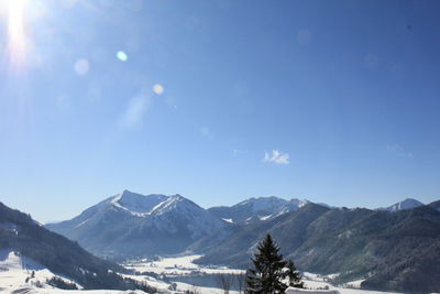 Scenic view of mountains against sky during winter