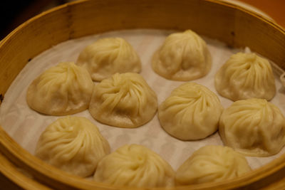 Close-up of chinese dumplings in bamboo bowl