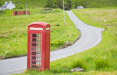 Lonely phone boot ona single lane road,isle of skye 