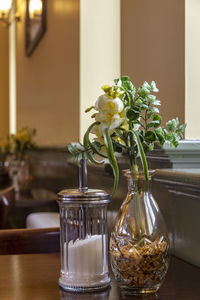 Flower vase on table at home