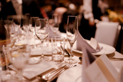 Close-up of wineglasses on table