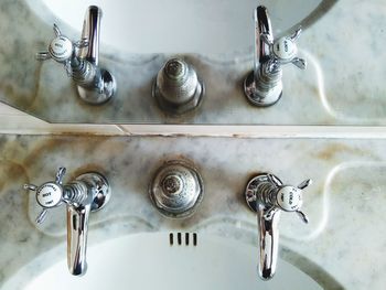 High angle view of faucet on wall at home