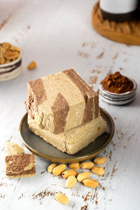 Minimalistic. tasty eastern sweet dessert halva from sunflower seeds, cashew, cocoa and tahini 