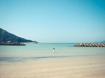 Scenic view of sea against clear blue sky