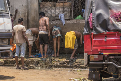 People working on street in city