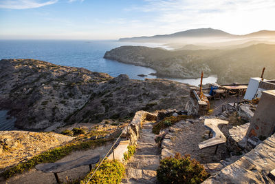 High angle view of sea and mountains against sky