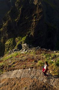 High angle view of woman walking on steps at mountain