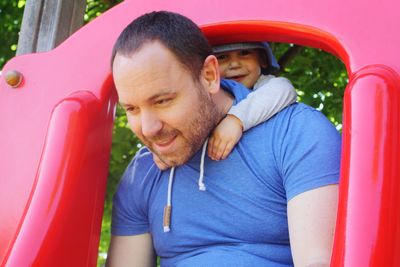 Close-up of father with son playing outdoors