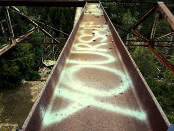 Close-up of rusty metallic bridge in park