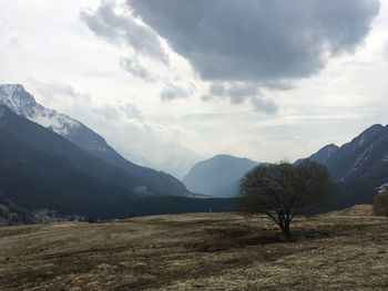 Scenic view of landscape and mountains against sky