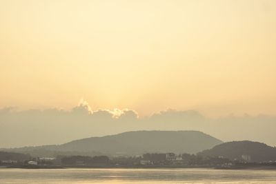 Scenic view of silhouette mountains against sky during sunset