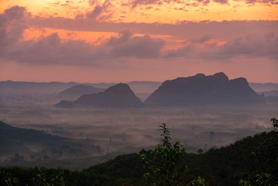 Scenic view of mountains against sky during sunset