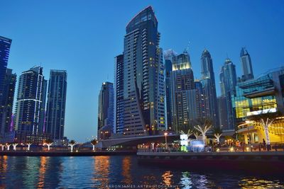 Skyscrapers lit up at waterfront