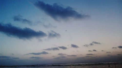 Scenic view of sea against sky at dusk