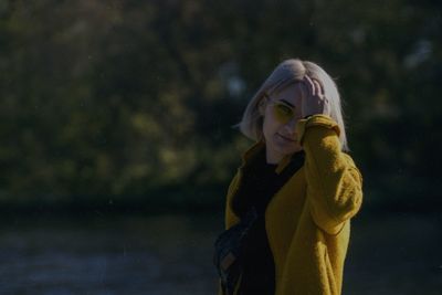 Portrait of a young woman standing in water