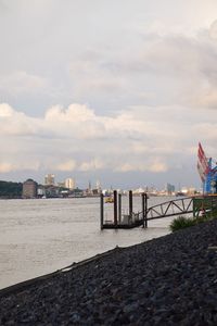 Scenic view of beach against sky in city