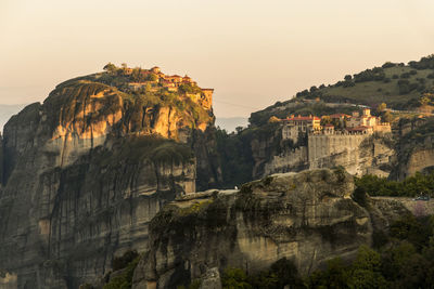 Rock formations on mountain against sky