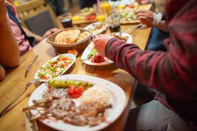 Midsection of woman eating food