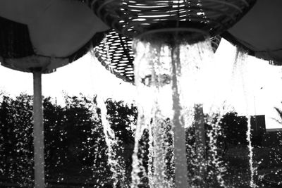 Low angle view of water drops on glass