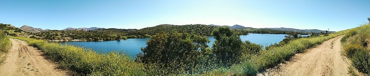 Scenic view of landscape against clear blue sky