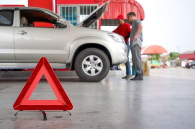 Rear view of man standing on road